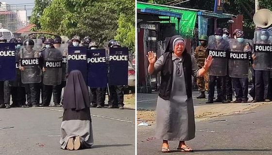 무차별 총격에 무릎을 꿇은 수녀, 나무 방패를 든 시위대